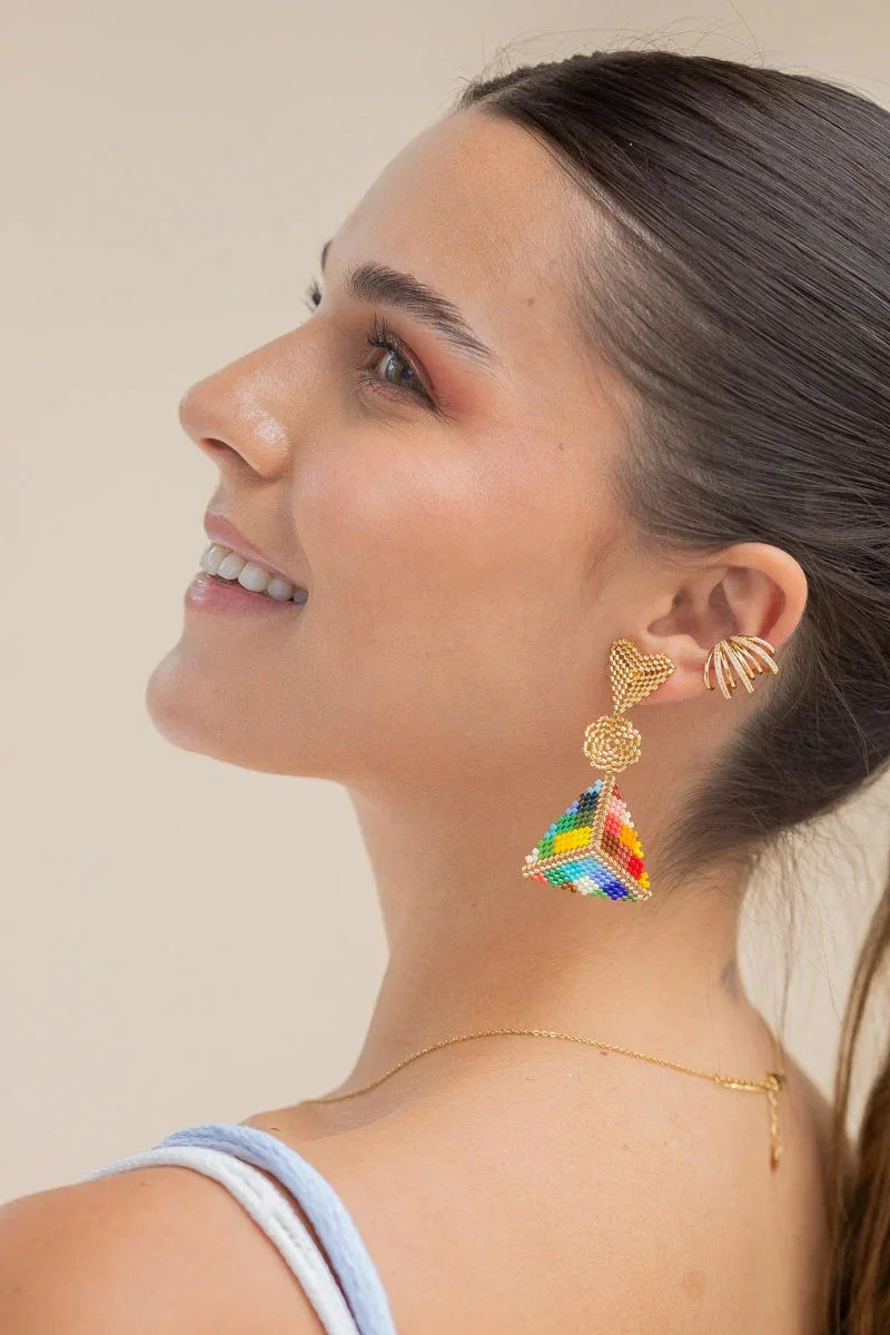 Woman wearing handmade beaded rainbow earrings and gold jewelry, Jabatzelet jewelry