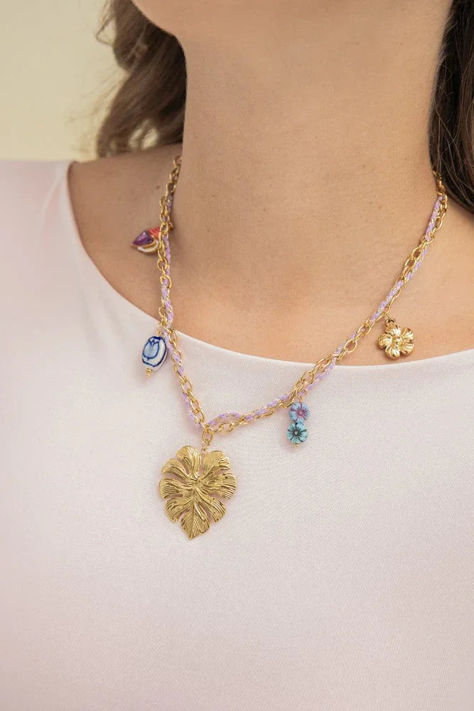 Handmade gold leaf necklace with colorful charms, Jabatzelet jewelry on woman in white top