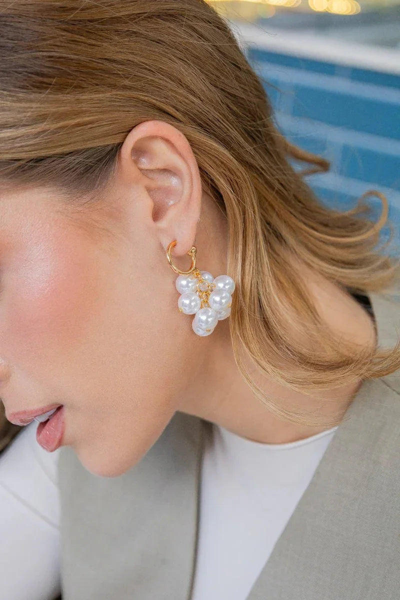 Handmade gold earring with cluster of pearls on woman, Jabatzelet jewelry